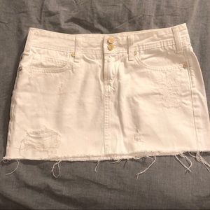 Distressed white denim mini